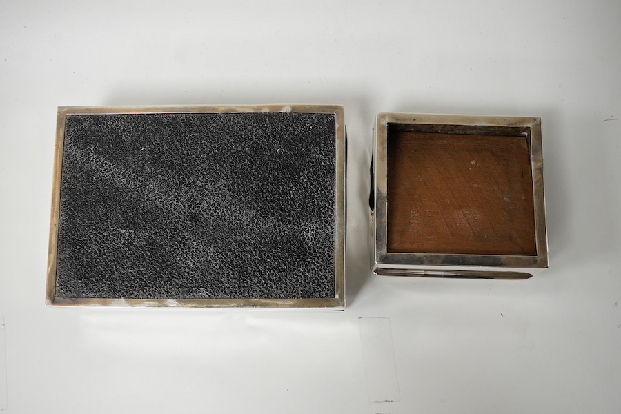 Two silver engraved cigarette boxes (a.f.). largest 16.6cm. Condition - poor